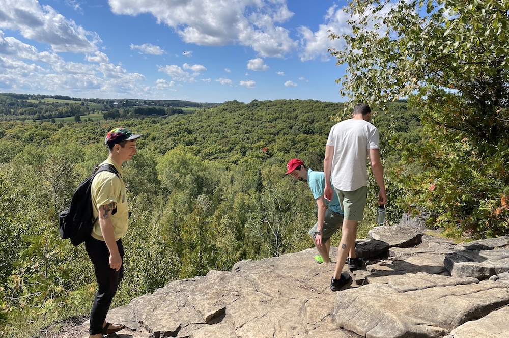 three siblings on a hike